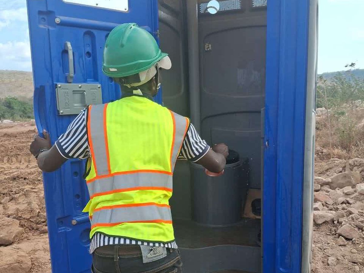 Temporary toilet unit being installed