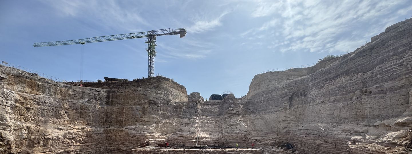 Guardrails along the crest of a high excavation slope