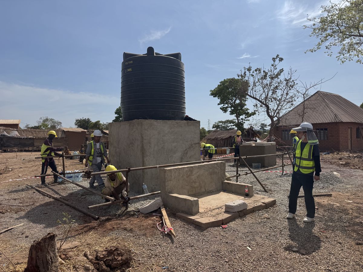 Finishing work on the tank plinth and tap stands at Igamba, 21 September 2026