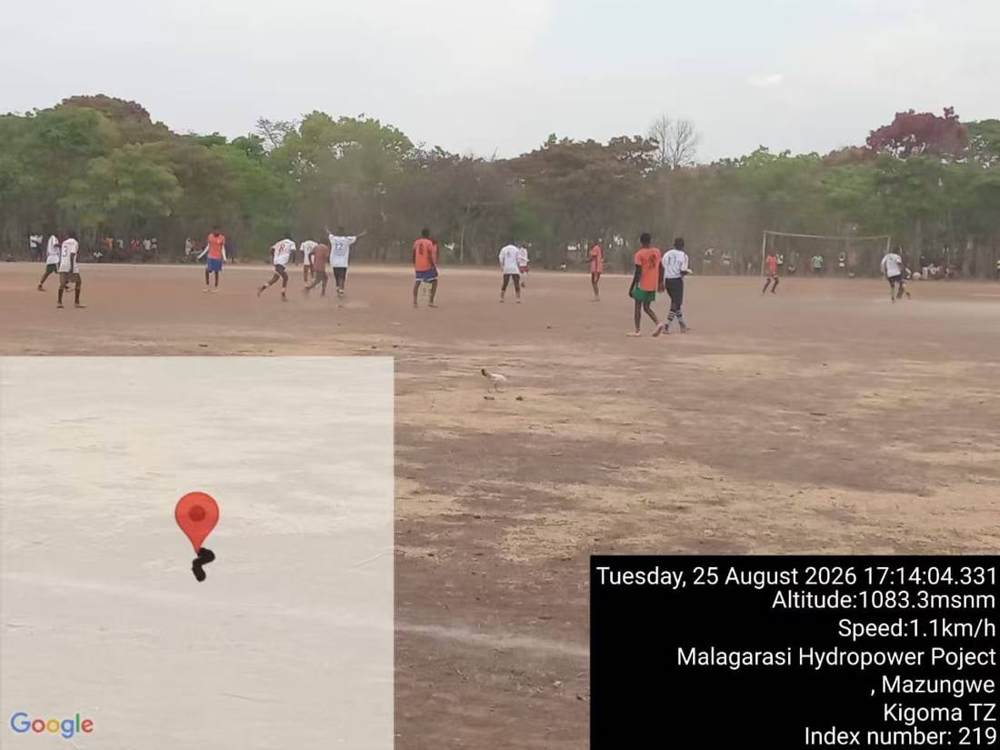 Football match in progress on the village pitch